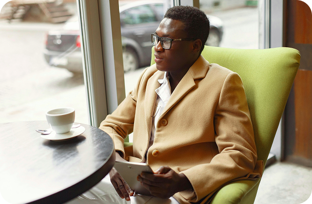 Person working with a cup of coffee